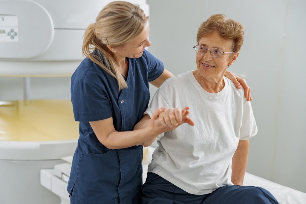 doctor-radiologist-help-to-patient-sit-after-proce-2022-06-24-14-16-58-utc.jpg